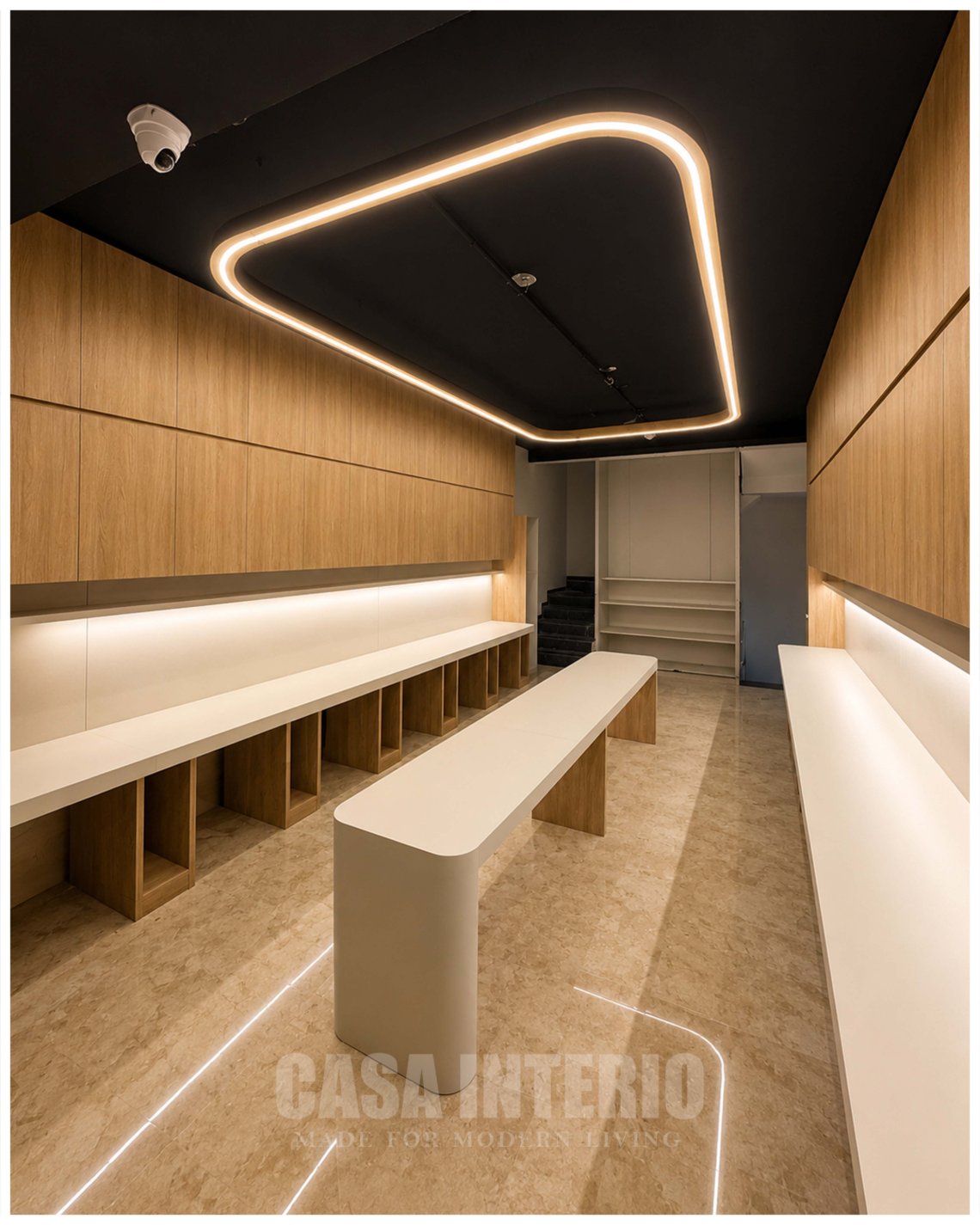 Work bay framed by a continuous loop of warm cove lighting
