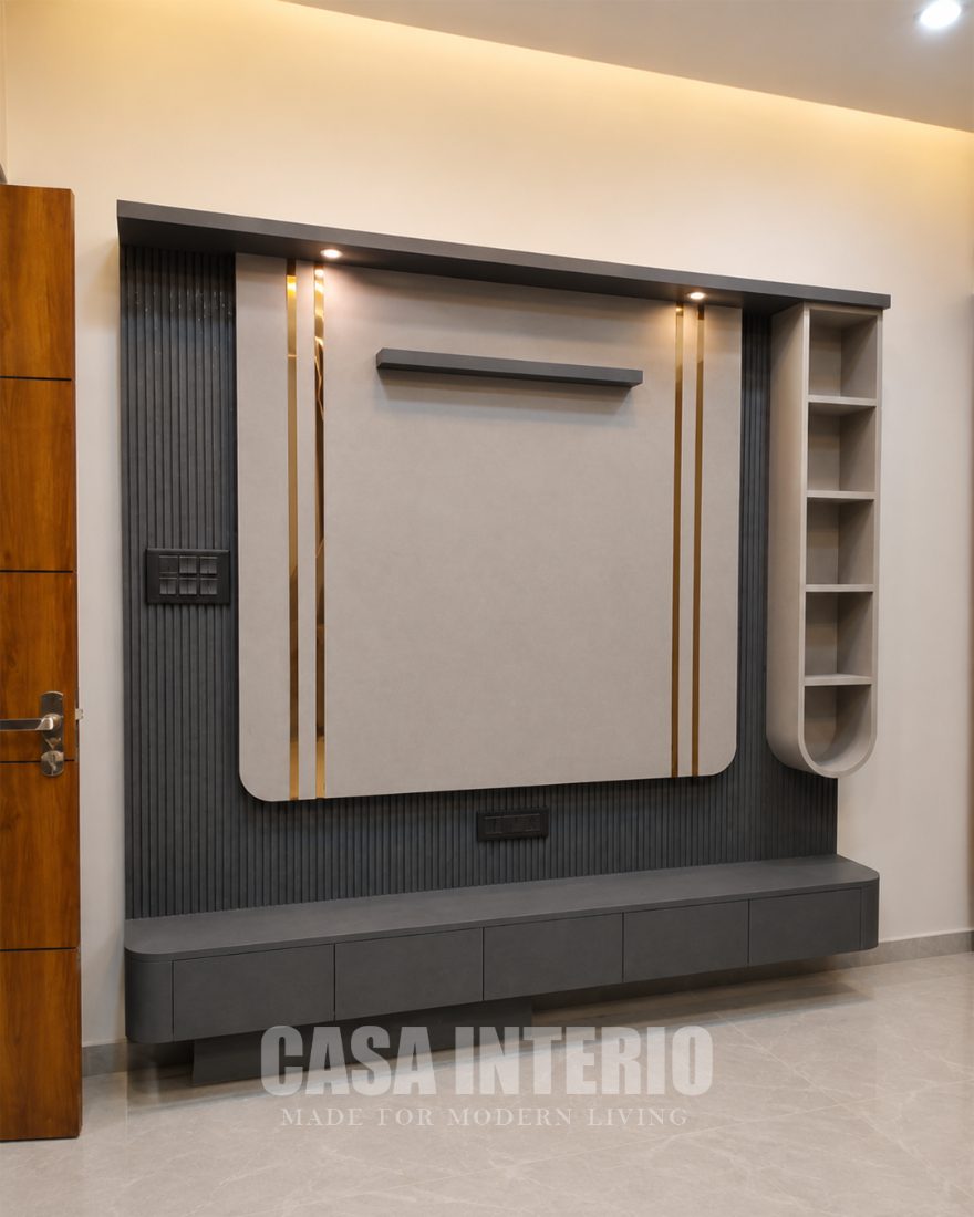 Graphite television panel with brass inlay and curved shelving