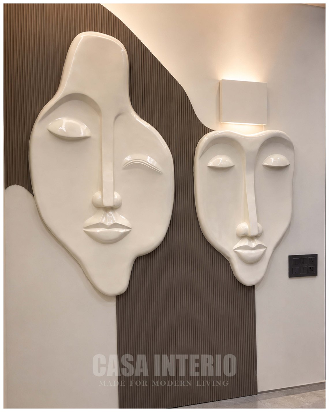 Sculptural twin-face wall panels on a fluted brown feature wall