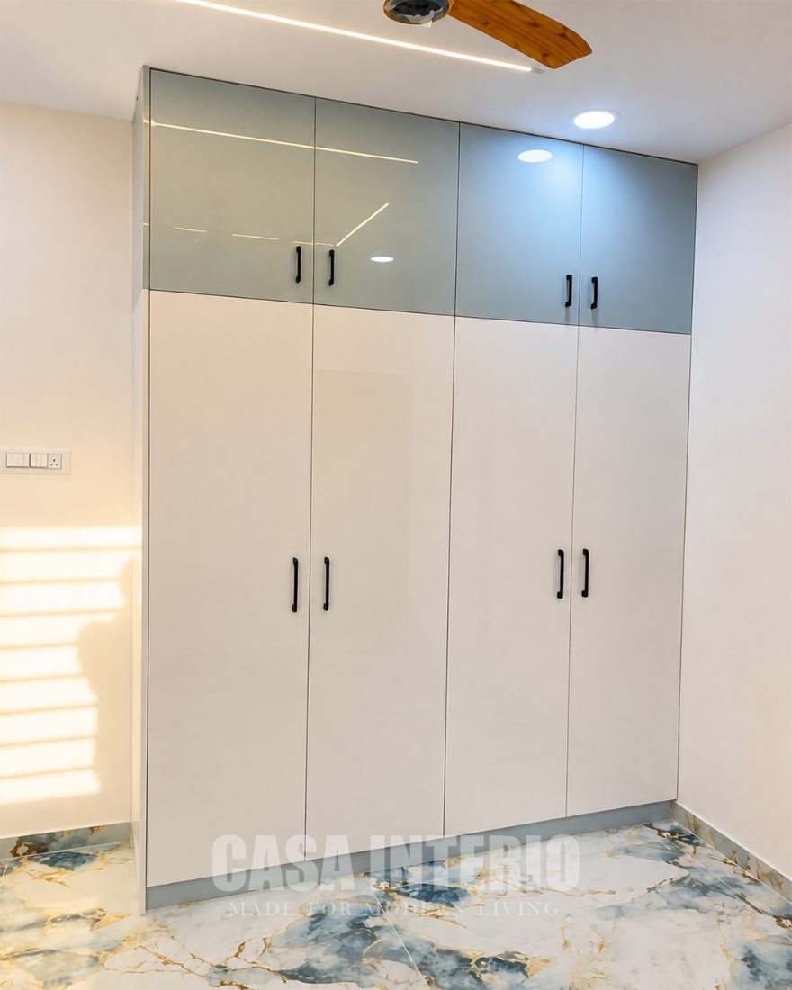 Gloss white wardrobe with grey-blue loft shutters
