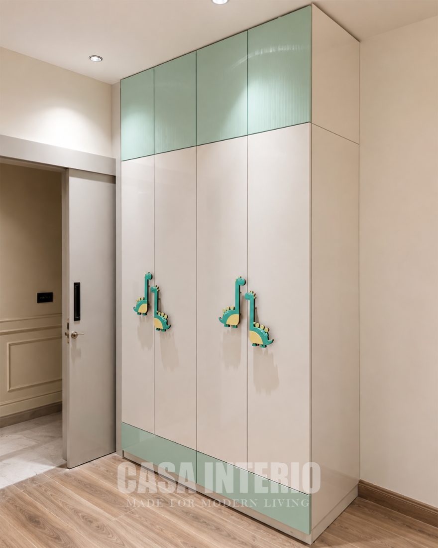 Children's wardrobe in beige with mint lofts and animal handles